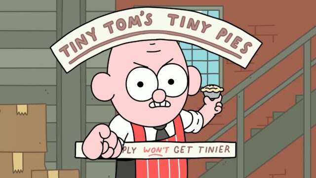 Screenshot from the game Thank Goodness You're Here! Tiny Tomy is pointing at the camera with one hand and holding a tiny pie with the other. Above him is a banner that reads, "Tiny Tom's Tiny Pies." The entire phrase is underlined. The bottom banner says, "You simply won't get tinier" with 'won't underlined and red.