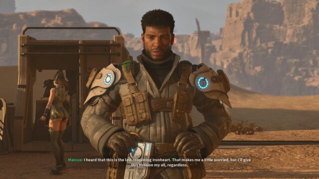 A screenshot of the game The First Descendant showing Marcus with his hands on his belt looking tired at the player. In the background, Luna is dancing with her ass out. Marcus is saying, "I heard that this is the last remaining Ironheart. That makes me a little worried, but I'll give this mission my all, regardless.