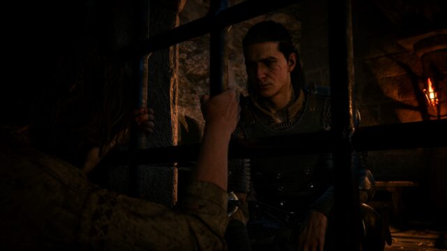 Screenshot from The Blood of Dawnwalker where protagonist, Coen, meets a prisoner outside of a jail cell.
